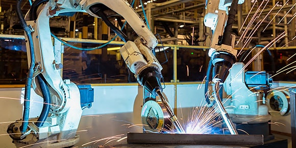 Two machines welding in a technology laboratory