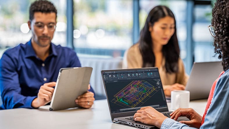 People working around a table in an office 