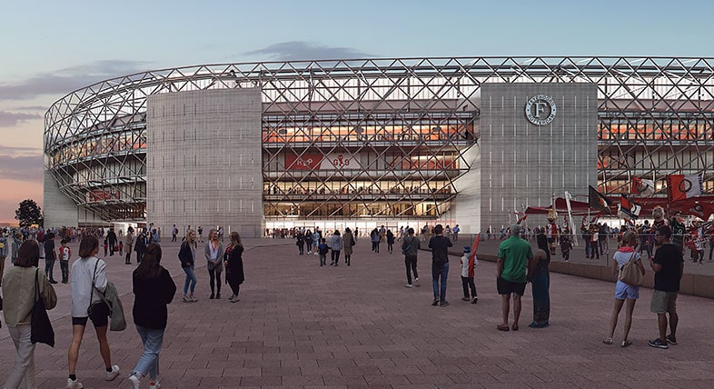 Spectators walking toward the Feyenoord Stadium in Rotterdam